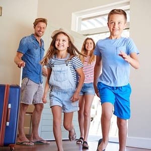 family walking into rental property